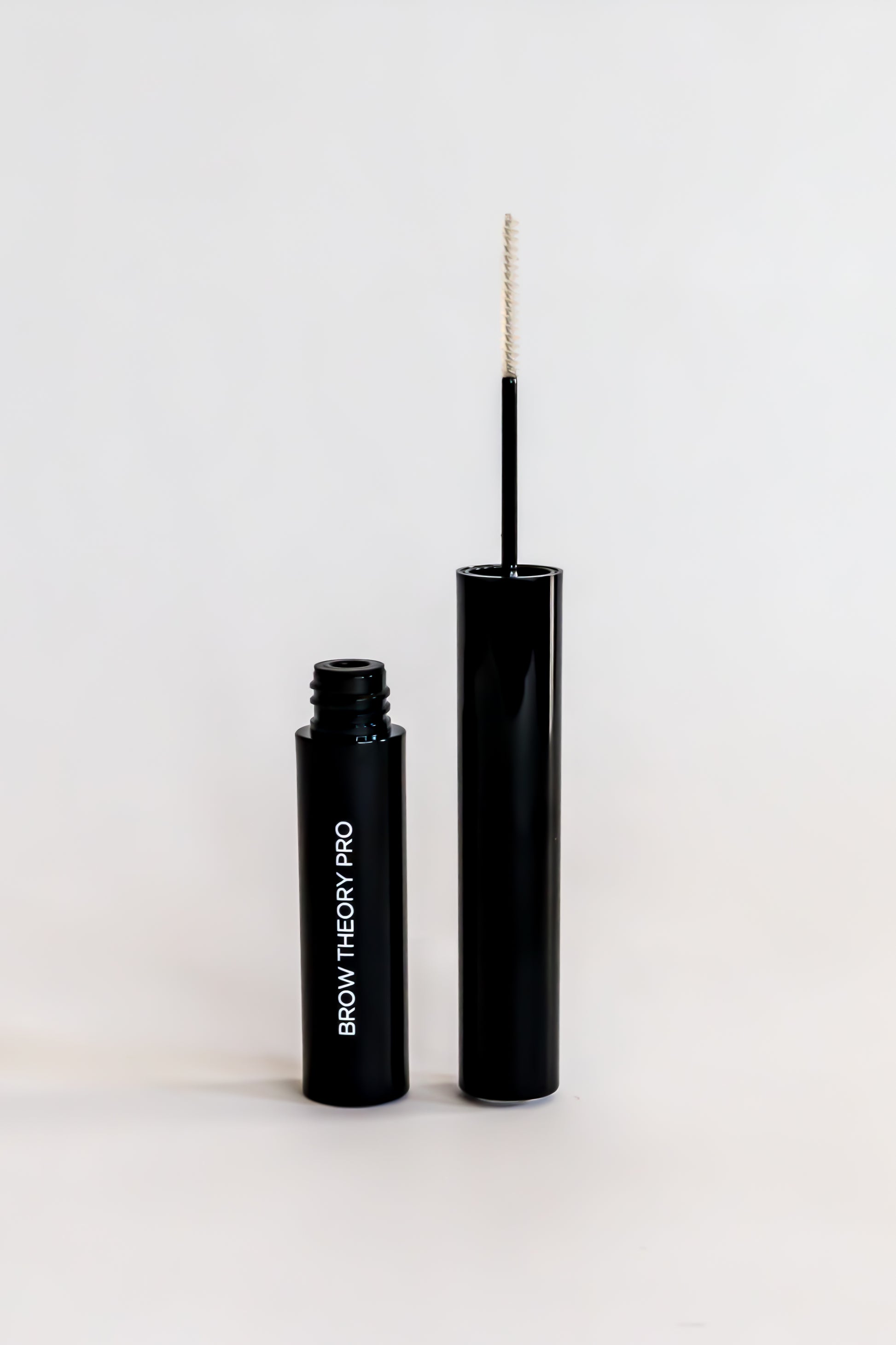 Black Brow Theory Pro product with applicator on a white background